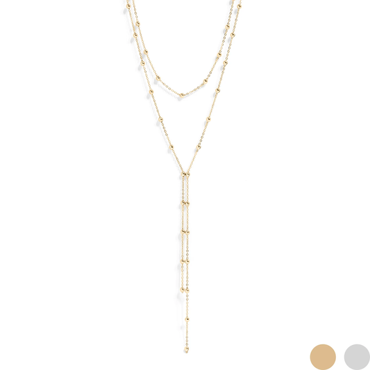 Gold layered necklace on a white background