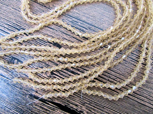 Crystal Bicone Beads, Gold Clear, Faceted, 5mm x 1mm hole, Strand approx 60X
