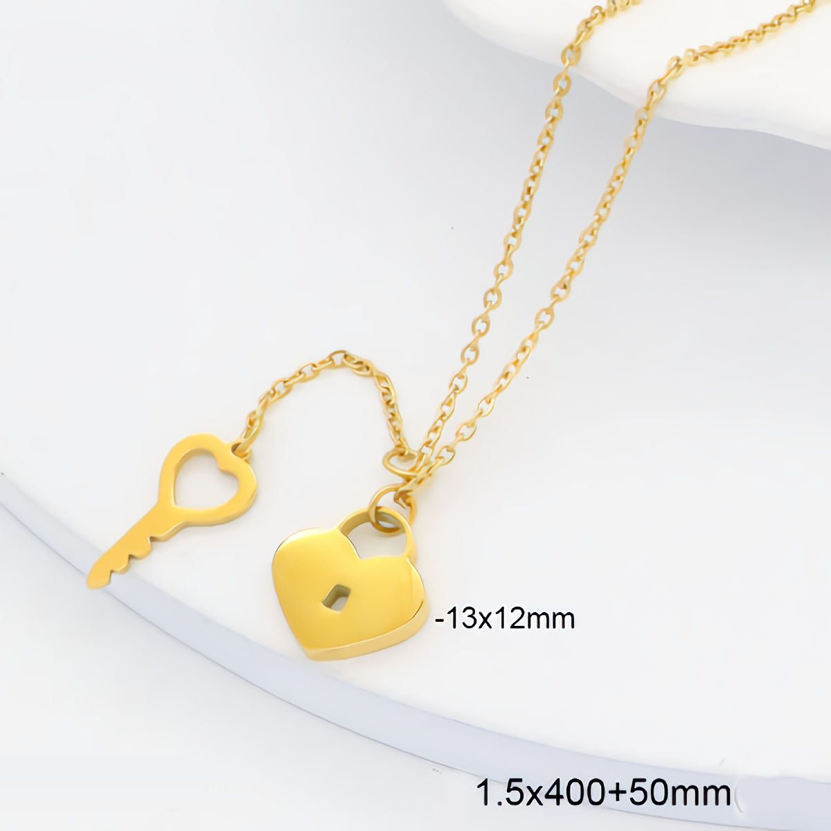 Gold heart-shaped padlock pendant necklace with a key charm on a white background, with size text overlays '-13x12mm' and '1.5x400+50mm'.