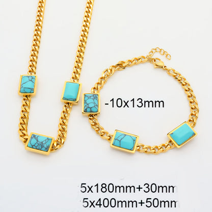 Ninky Design Gold chain necklace with turquoise stones on a white background