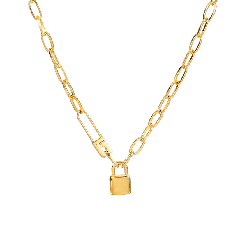Gold chain necklace with a padlock pendant on a white background