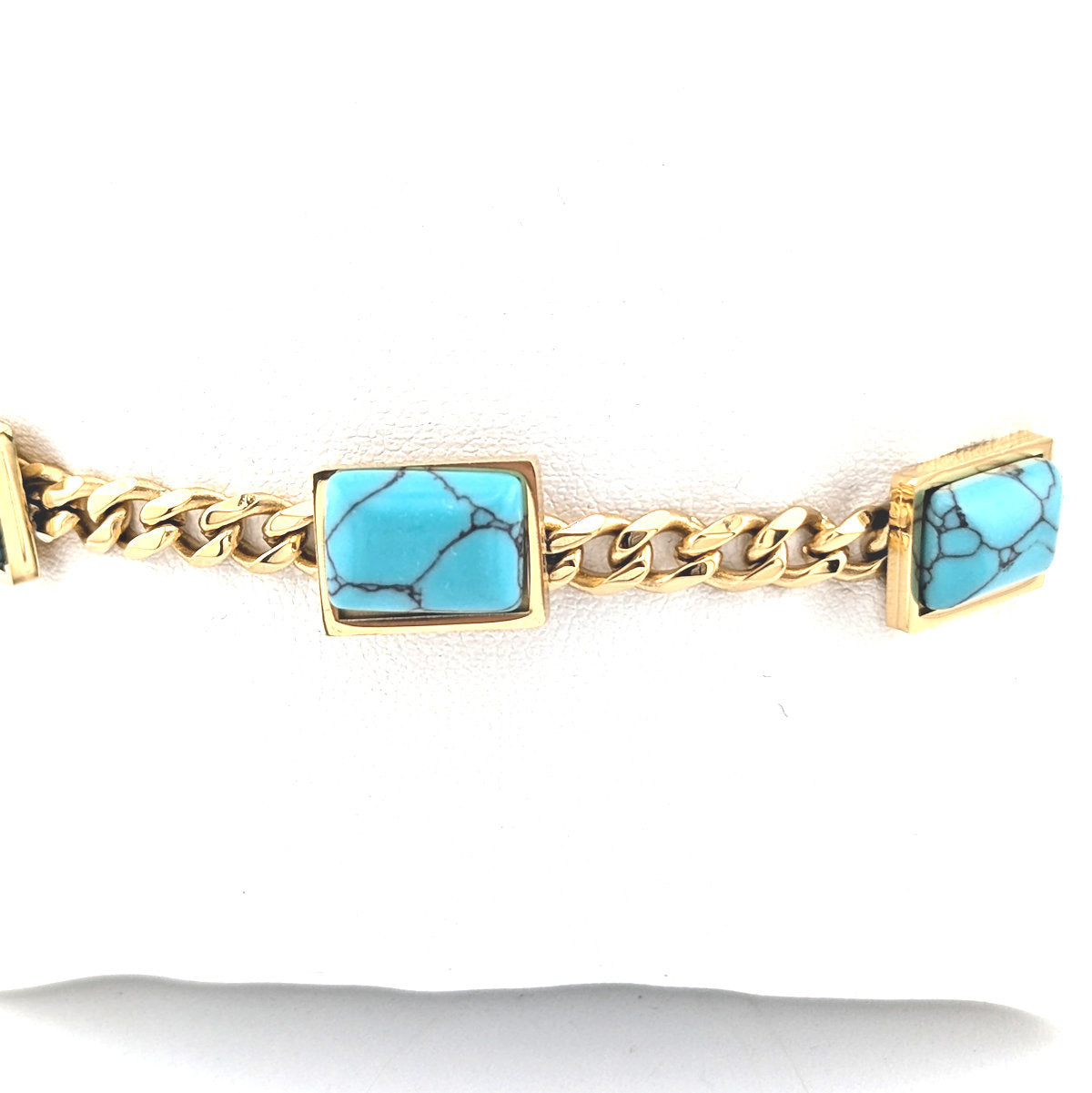 Ninky Designs Gold bracelet with turquoise square stones on a white background