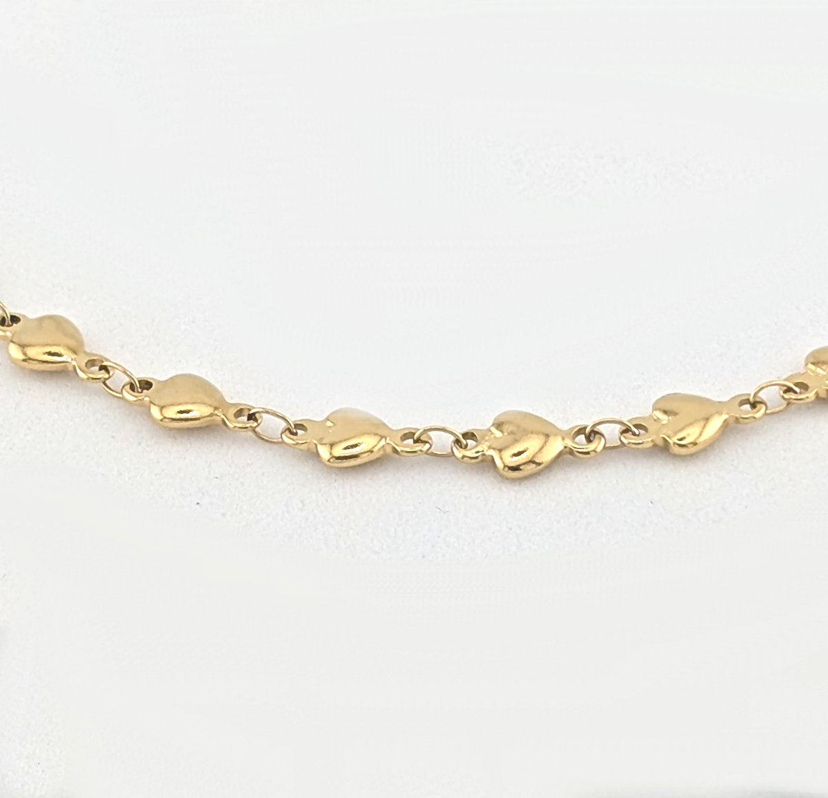 Ninky Designs Gold heart chain necklace on a white background
