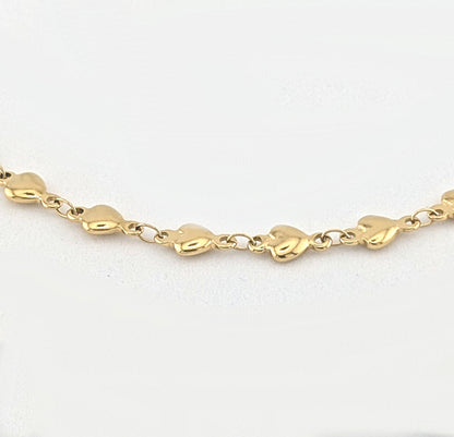 Ninky Designs Gold heart chain necklace on a white background