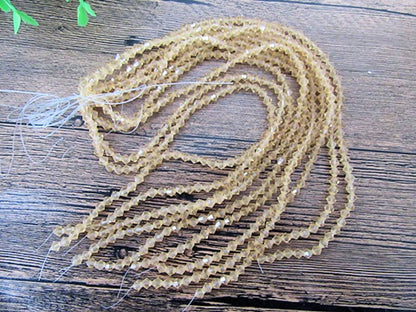 Crystal Bicone Beads, Gold Clear, Faceted, 5mm x 1mm hole, Strand approx 60X