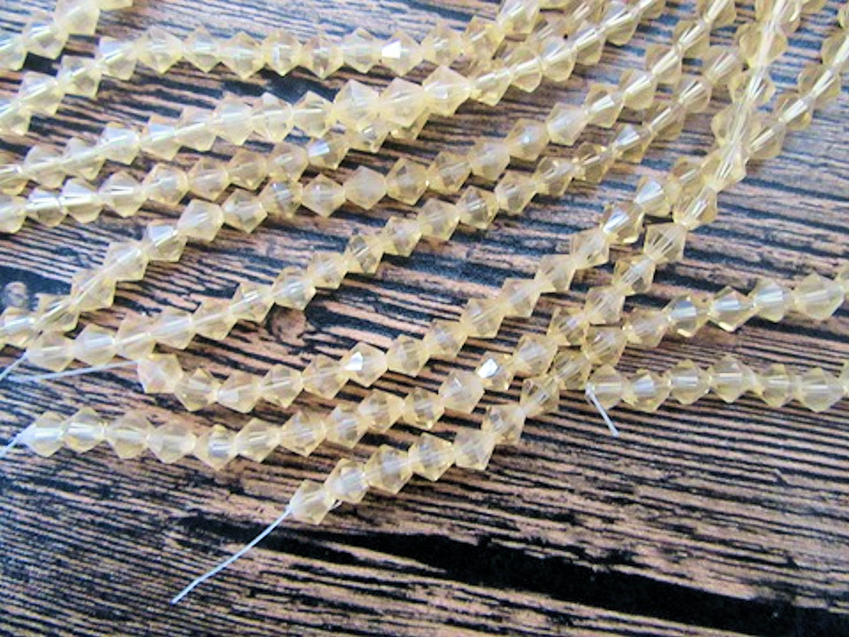 Crystal Bicone Beads, Gold Clear, Faceted, 5mm x 1mm hole, Strand approx 60X