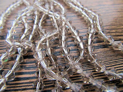 Crystal Bicone Beads, 5mm, Light Smoke, Faceted, Strand approx 60X, 1mm hole