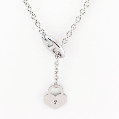 This 18K Gold plated, Stainless Steel chain necklace features a distinctive toggle closure and a heart-shaped padlock pendant