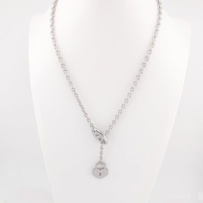 This 18K Gold plated, Stainless Steel chain necklace features a distinctive toggle closure and a heart-shaped padlock pendant